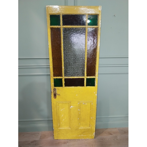 12 - Early 20th C. painted pine panelled door with stained glass panels. {198 cm H x 68 cm W}.