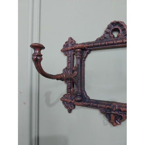 16 - Bronzed painted cast iron hanging coat rack. {19 cm H x 63 cm W x 11 cm D}.