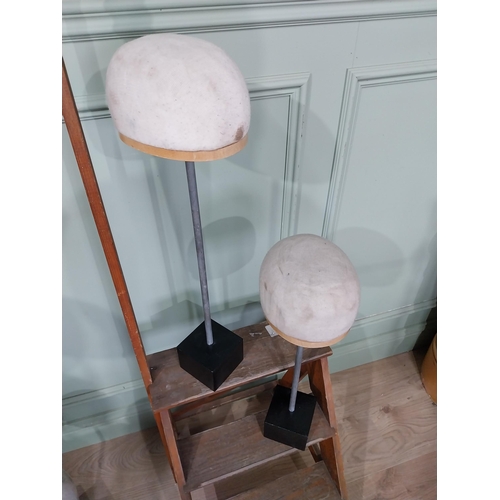 20 - Two mid century hat blocks. {65 cm H x 17 cm W x 20 cm D} and {54 cm H x 17 cm W x 20 cm D}.