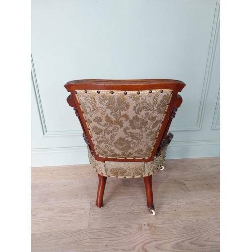 26 - Victorian walnut and upholstered nursing chair on turned legs with brass castors.{70 cm H x 50 cm W ... 