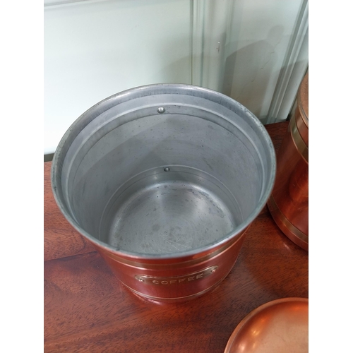 41 - Set of three brass and copper lidded urns - Coffee Tea and Sugar. {20 cm H x 14 cm Dia.}.