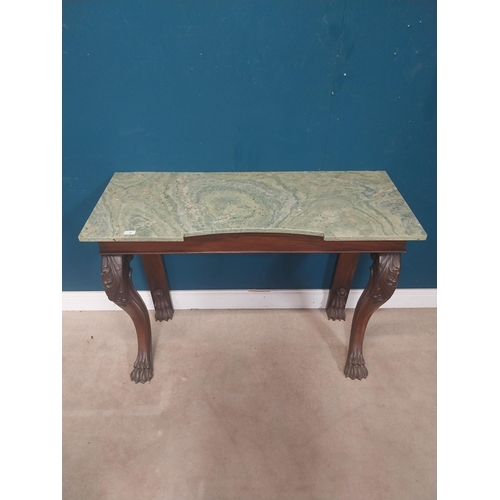 45 - William IV Irish mahogany console table with shaped marble top raised on carved legs on claw feet. {... 