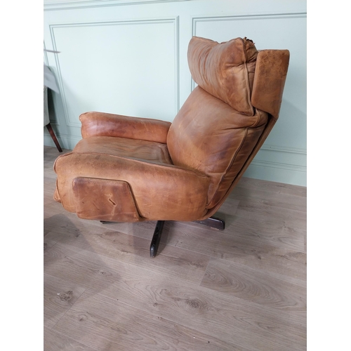 55 - Mid century tan leather swivel easy chair {92 cm H x 87 cm W x 87 cm D} with matching footstool {40 ... 