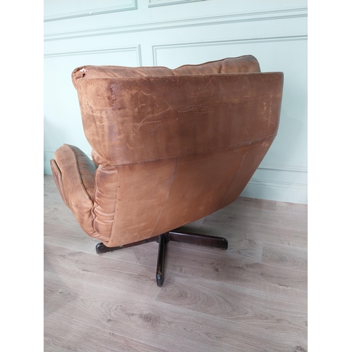 55 - Mid century tan leather swivel easy chair {92 cm H x 87 cm W x 87 cm D} with matching footstool {40 ... 