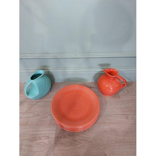 59 - Seven pieces of Fiesta ware - five plates and two water jugs. {30 cm Dia.} and {32 cm H x 23 cm W x ... 