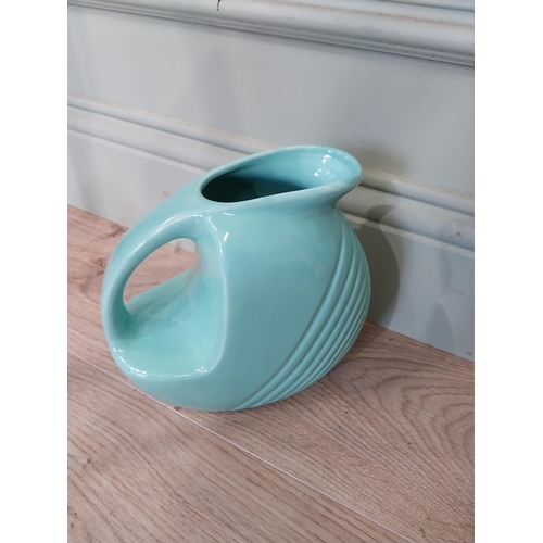 59 - Seven pieces of Fiesta ware - five plates and two water jugs. {30 cm Dia.} and {32 cm H x 23 cm W x ... 