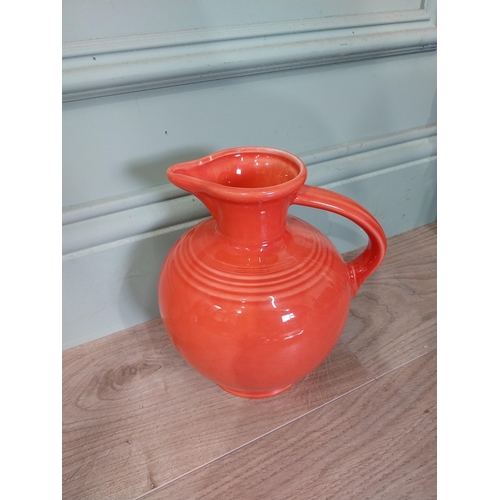 59 - Seven pieces of Fiesta ware - five plates and two water jugs. {30 cm Dia.} and {32 cm H x 23 cm W x ... 