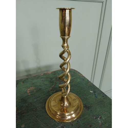 60 - Pair of brass candlesticks with spiral column. {26 cm H x 11 cm Dia.}.