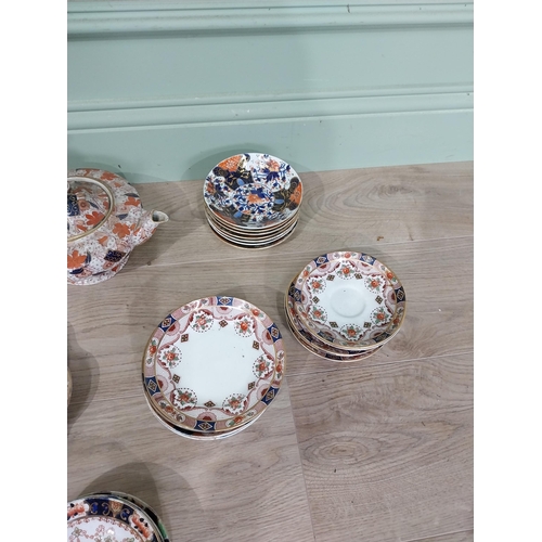 61 - Collection of thirty seven oriental ceramic plates, saucers and tea pots by Royal Stafford, Royal Ta... 