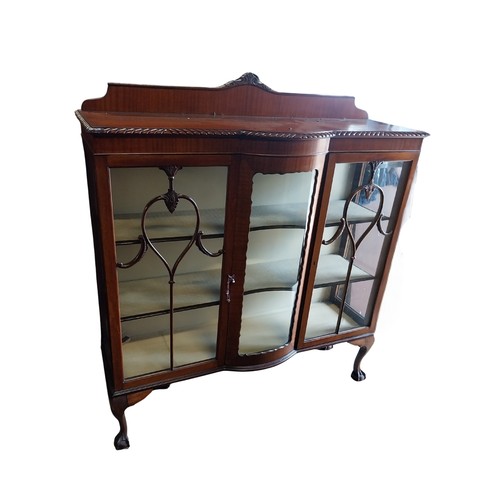23A - Edwardian mahogany display cabinet on ball and claw feet. {144 cm H x 122 cm W x 40 cm D}.