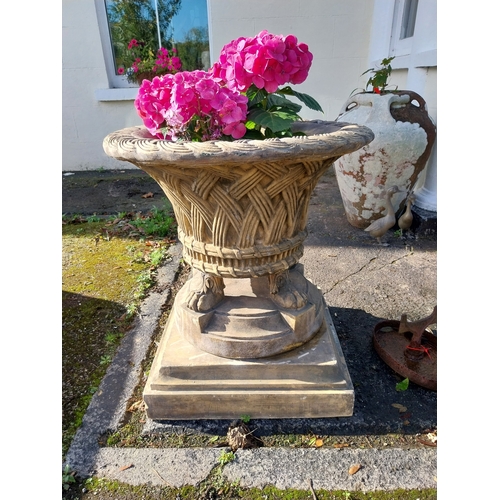 10 - Pair of good quality moulded terracotta lattice design urns, raised on platform bases and lion's paw... 
