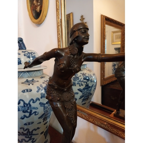 134 - Bronze figure of a Dancer, mounted on a marble base, in the Art Deco style. { 50cm H X 35cm W X 12cm... 