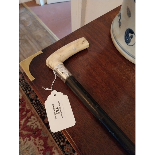 135 - 19th. C. ebony walking stick with silver band and bone handle. { 90cm H }.