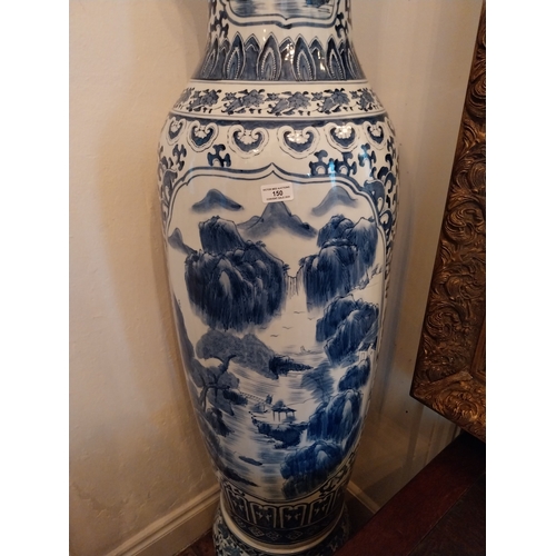 150 - Decorative Oriental blue and white ceramic vase of large proportions. { 152cm H X 47cm Dia }.