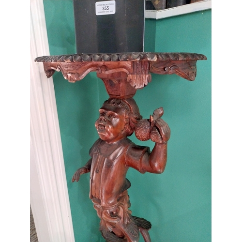 354 - 19th. C. carved walnut jardieiere stand decorated with a Cherub. { 89cm H X 48cm Dia }.