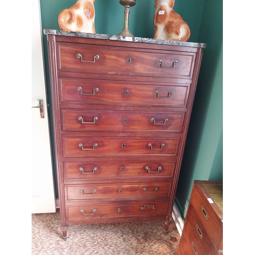 379 - 19th. C. French mahogany tallboy, the marble top above seven long drawers, raised on turned legs. { ... 