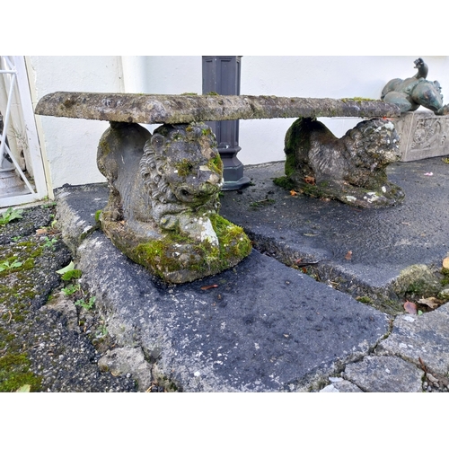 5 - Early 20th. C. weathered moulded sandstone bench, raised on lion supports. { 40cm H X 138cm W X 58cm... 