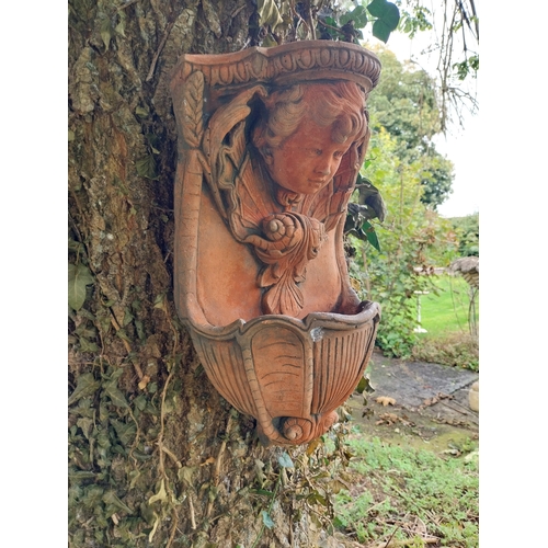 51 - Pair of terracotta hanging planters. { 44cm H X 28cm W X 17cm D }.