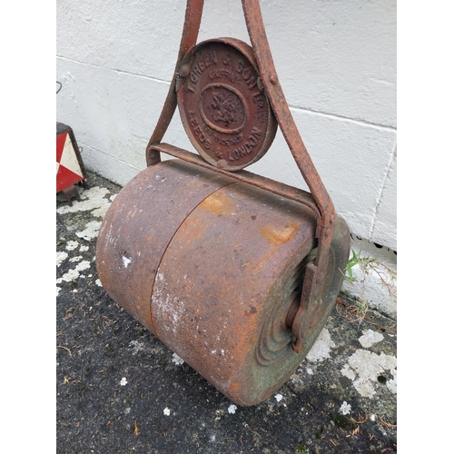 64 - Early 20th. C. cast iron garden roller. { 114cm H X 47cm W X 41cm D }.