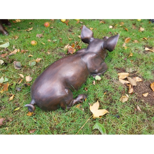 69 - Good quality bronze sculpture of a Piglet lying down. { 23cm H X 67cm W X 30cm D }.