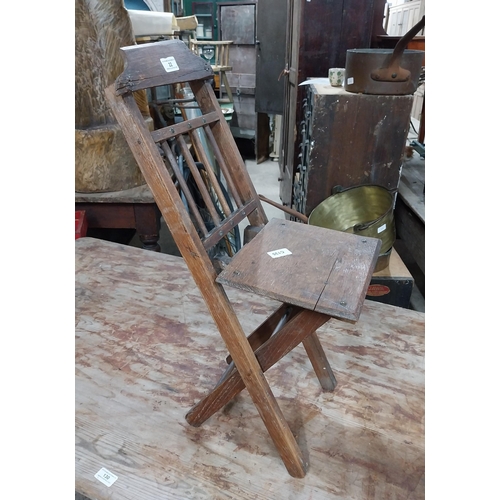 22 - Early 20th C. oak folding fisherman's chair. {67 cm H x 26 cm W x 39 cm D}.