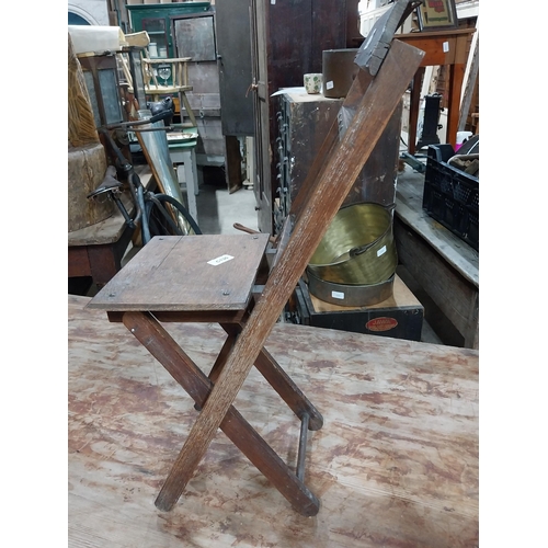 22 - Early 20th C. oak folding fisherman's chair. {67 cm H x 26 cm W x 39 cm D}.