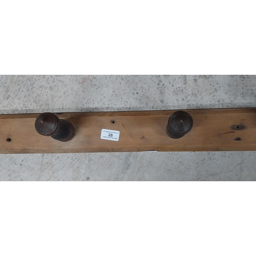 28 - 19th C. pine and mahogany wall hanging coat rack. {8 cm H x 138 cm W}.