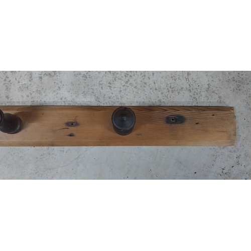 28 - 19th C. pine and mahogany wall hanging coat rack. {8 cm H x 138 cm W}.