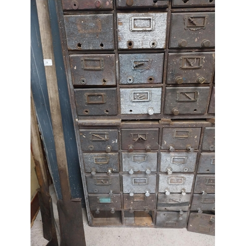 35 - 20th C. oak bank of fifty drawers (two missing). {130 cm H x 90 cm W x 35 cm D}.