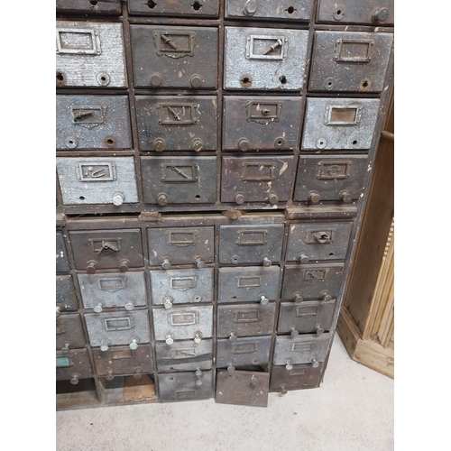 35 - 20th C. oak bank of fifty drawers (two missing). {130 cm H x 90 cm W x 35 cm D}.