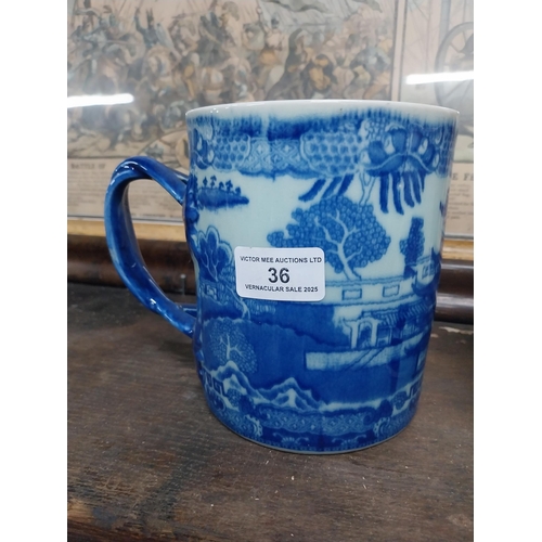 36 - Large blue and white Willow pattern mug and brown jug decorated with flowers. {14 cm H x 17 cm Dia a... 