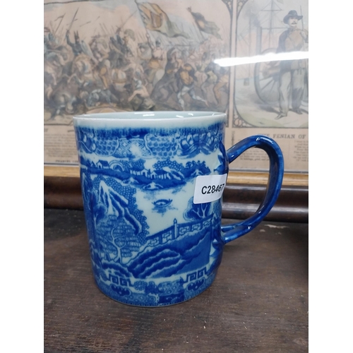 36 - Large blue and white Willow pattern mug and brown jug decorated with flowers. {14 cm H x 17 cm Dia a... 