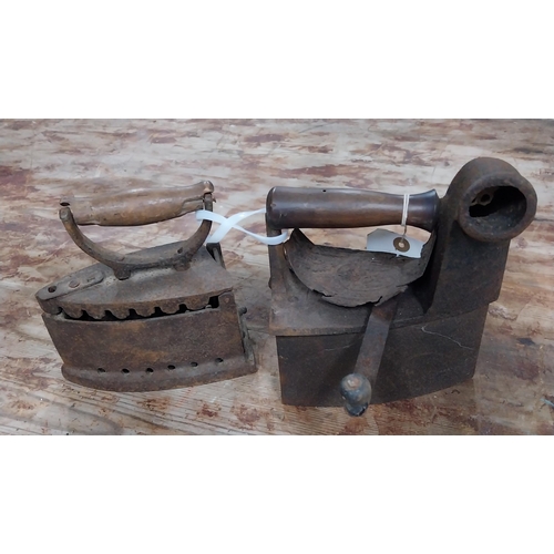 38 - Two Victorian cast iron smoothing irons. {20 cm H x 18 cm W x 11 cm D}.