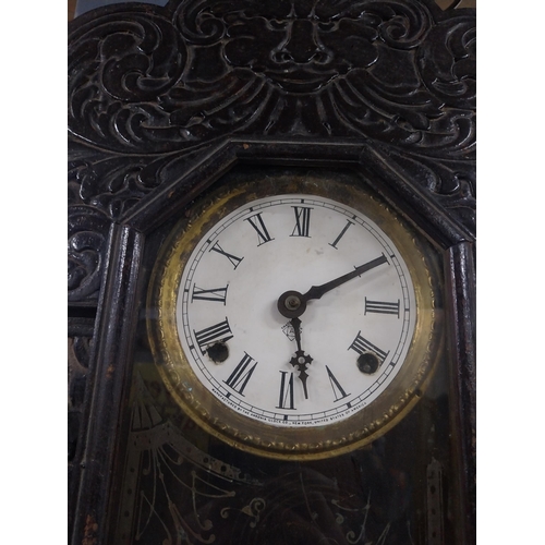 48 - 19th C. carved pine and ebonised ginger bread clock with enamel dial {61 cm H x 41 cm W x 11 cm D}.