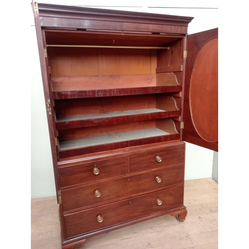 14 - 19th C.  mahogany linen press with two oval panelled doors over two short drawers over two graduated... 