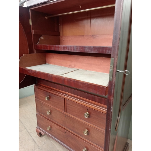 14 - 19th C.  mahogany linen press with two oval panelled doors over two short drawers over two graduated... 