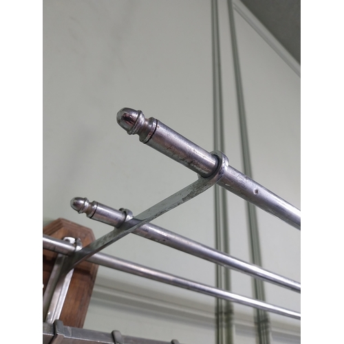 15 - Early 20th C. chrome wall mounted luggage rack. {20 cm H x 104 cm W x 30 cm D}.