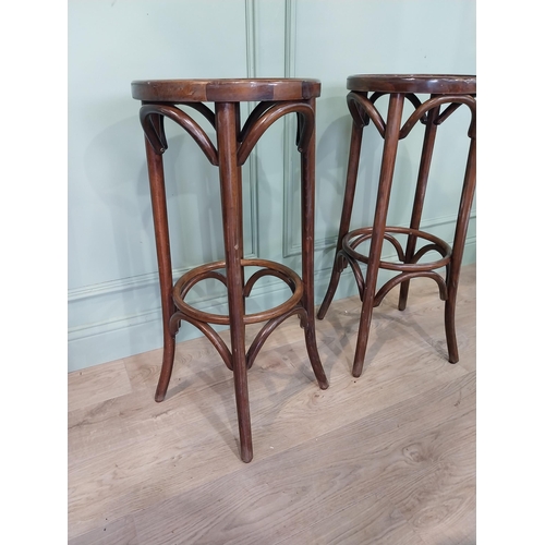 23 - Pair of bentwood high stools. [81 cm H x 36 cm Dia.}.