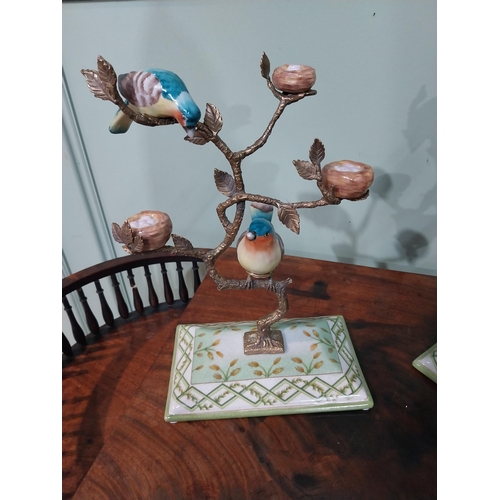 33 - Pair of decorative ceramic and brass model birds on trees. {28 cm H x 20 cm W x 12 cm D}.