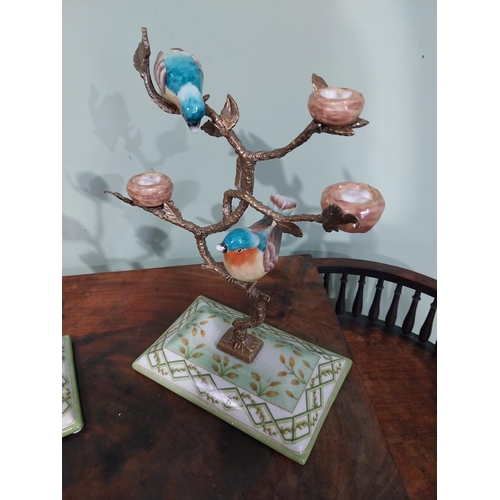 33 - Pair of decorative ceramic and brass model birds on trees. {28 cm H x 20 cm W x 12 cm D}.