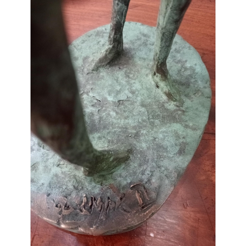 44 - A bronze study of two figures with umbrellas signed on the base. J McCarthy  {H 40cm x W 15cm x D 20... 