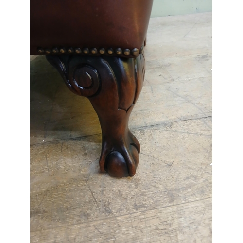 46 - Highback leather armchair on claw and ball feet in the Tetrad Oskar style. {H 100cm x W 84cm x D 84c... 