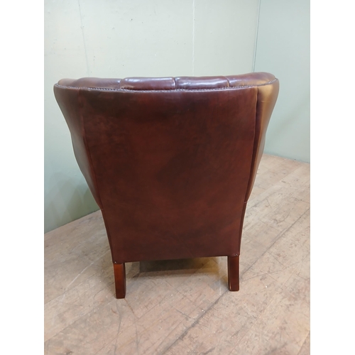 46 - Highback leather armchair on claw and ball feet in the Tetrad Oskar style. {H 100cm x W 84cm x D 84c... 