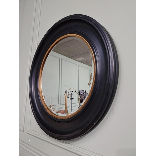 65 - Good quality ebonised and gilt circular wall mirror. {80 cm Dia.}.