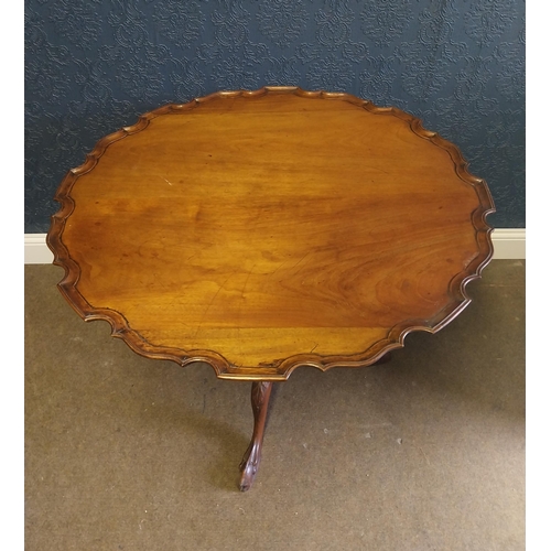 7 - 19th C. mahogany centre table in the Chippendale style on turned column and three outswept legs. {75... 