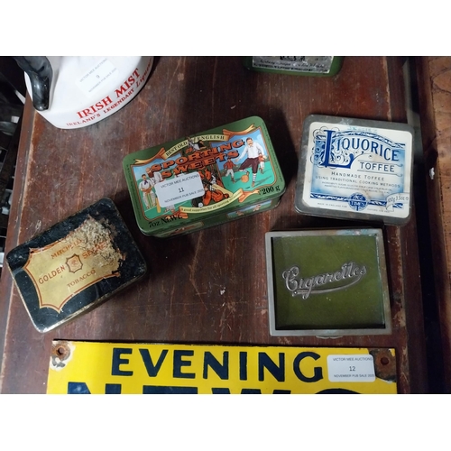 11 - Three advertising tins and a cigarette box.