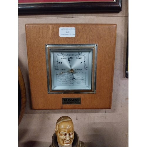 Guinness oak barometer. {22 cm H x 22 cm W}.