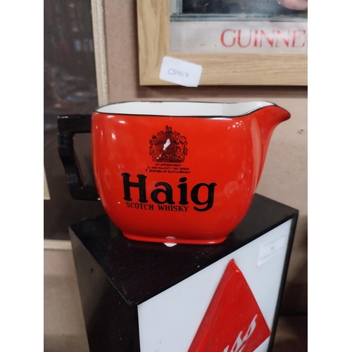 41 - Haig Scotch Whiskey ceramic advertising jug. {9 cm H x 16 cm W x 9 cm D}.