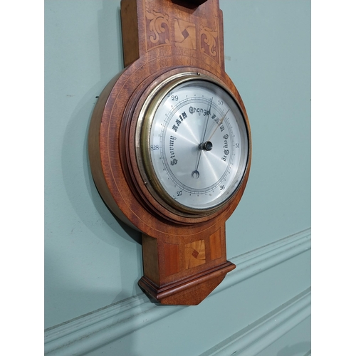 16 - Edwardian mahogany and satinwood inlaid barometer with silvered dial. {56 cm H x 19 cm W}.