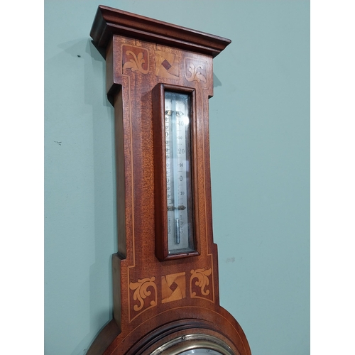 16 - Edwardian mahogany and satinwood inlaid barometer with silvered dial. {56 cm H x 19 cm W}.